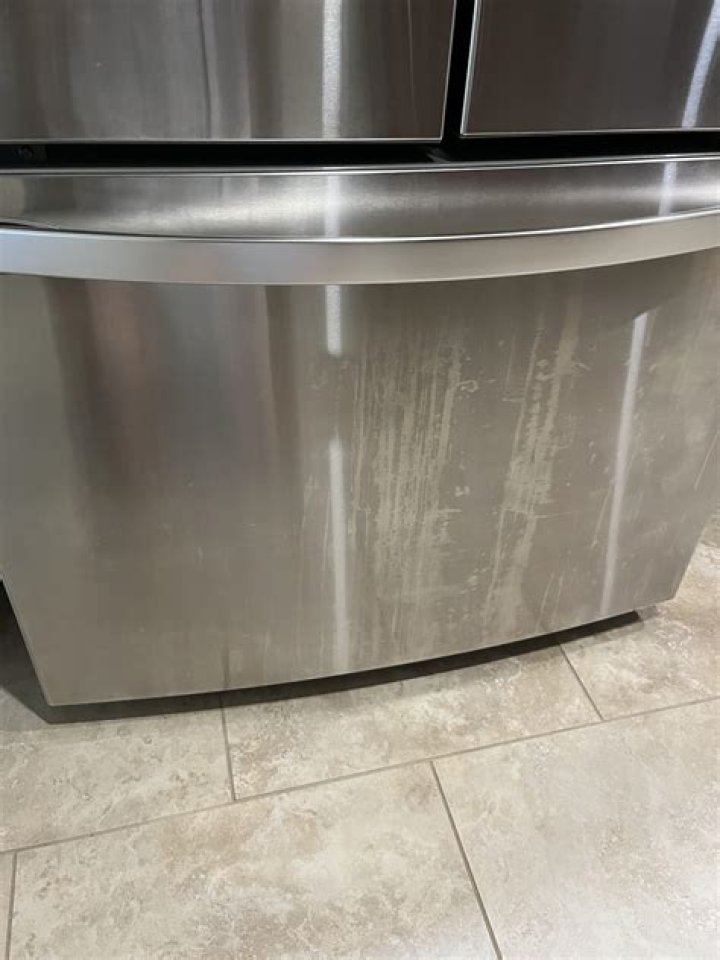 How do you remove acid stains from stainless steel appliances?